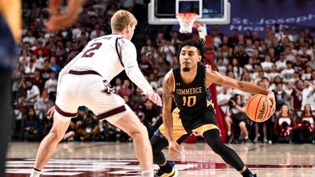 Nov 6, 2023; College Station, Texas, USA; Texas A&M Commerce guard Alonzo Dodd (10) controls the ball as Texas A&M Aggies guard Hayden Hefner (2) defends during the first half at Reed Arena. 